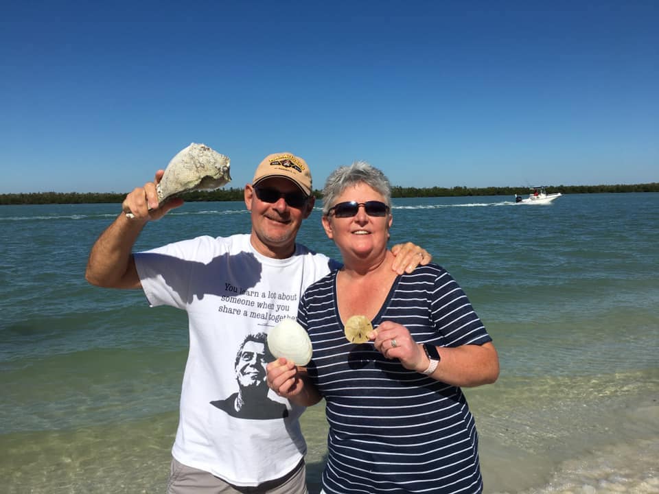 People Holding Their Seashells in Ten Thousand Islands